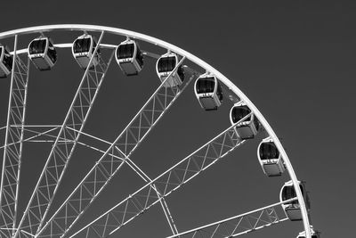 Low angle view of ferris wheel against sky