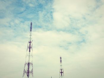 Low angle view of communications tower against sky