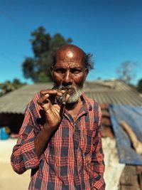 Portrait of man standing outdoors