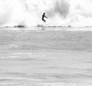 Man jumping in sea