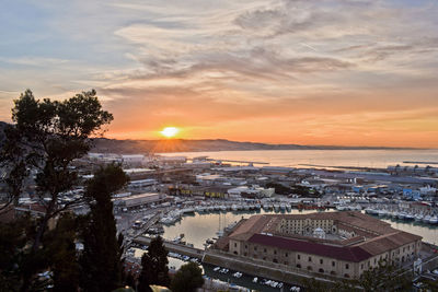 High angle view of cityscape against sky during sunset