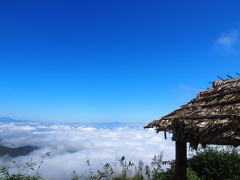 Scenic view of mountains against blue sky