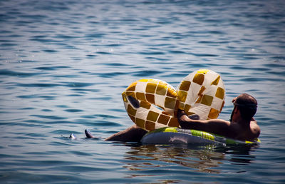 Man swimming in pool