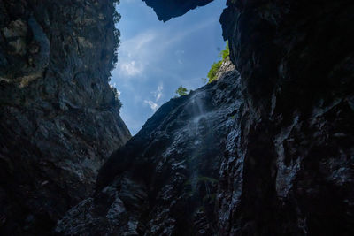 Low angle view of rock formation against sky