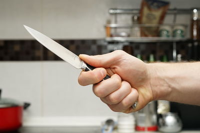 Close-up of hands holding knife
