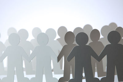 Low angle view of silhouette man against white background