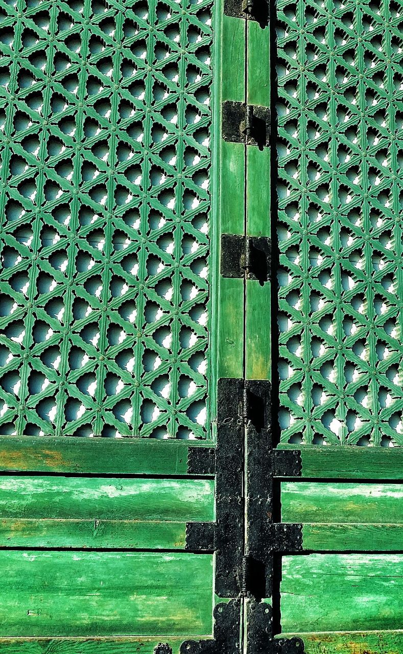 green color, closed, protection, door, wood - material, building exterior, safety, built structure, metal, architecture, security, window, pattern, wall - building feature, wooden, day, close-up, outdoors, house, no people