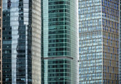 Low angle view of modern glass building in city