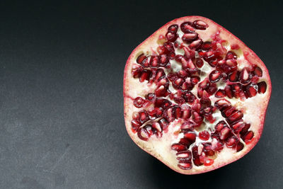 Close-up of fruits against black background