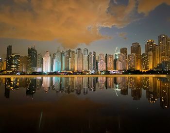 Night view of buildings by the sea
