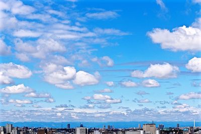 View of buildings against cloudy sky