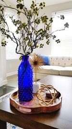 Close-up of flower vase on table at home