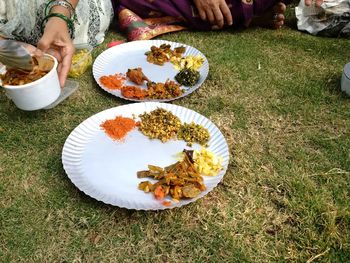 Low section of people sitting in bowl