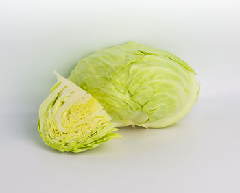 Close-up of green chili pepper on white background