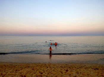 Scenic view of sea against sky at sunset