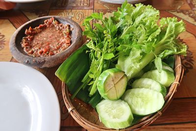 High angle view of vegetables in plate on table