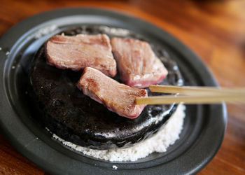 Close-up of meat in plate on table