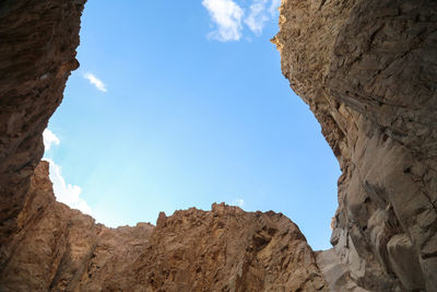 Low angle view of rock formations against sky