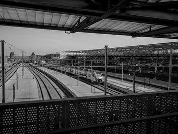 Train at railroad station against sky