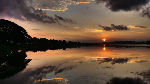 Scenic view of lake against sky during sunset