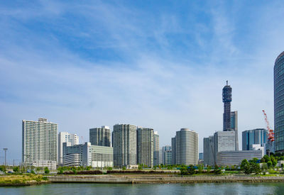 Modern buildings in city against sky