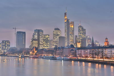 View of skyscrapers lit up at night