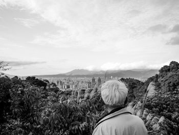 Scenic view of landscape against cloudy sky