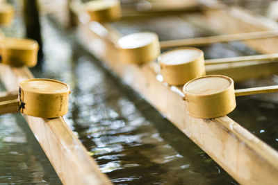 Close-up of bamboo dippers at shrine