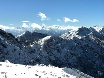 Scenic view of snowcapped mountains against sky