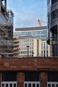 Low angle view of modern buildings against sky