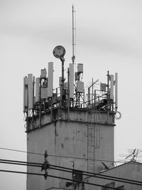 Low angle view of industry against sky