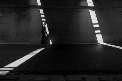 Man walking on road in city
