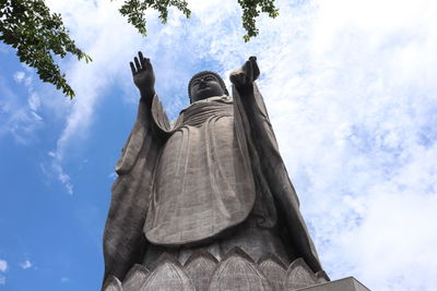 Low angle view of statue against sky