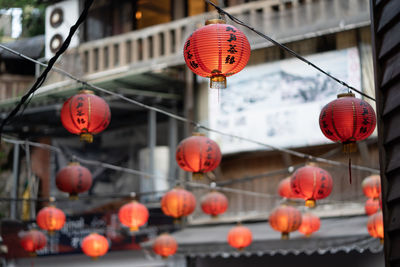 Low angle view of lanterns hanging on street