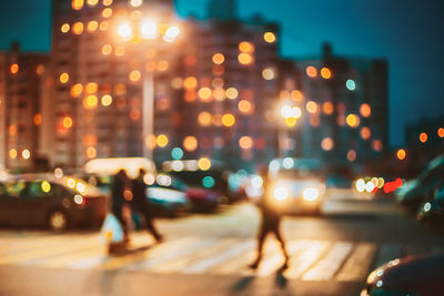 Defocused image of illuminated city at night