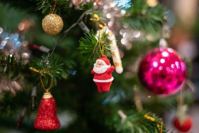 Close-up of christmas decorations hanging on tree