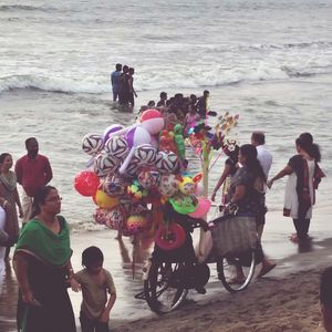 People enjoying on beach