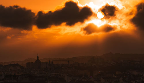 Cityscape against sky during sunset