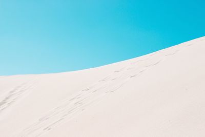 View of landscape against clear blue sky
