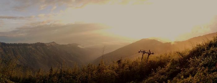 Scenic view of mountains against sky during sunset