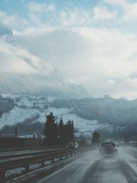 View of road against cloudy sky