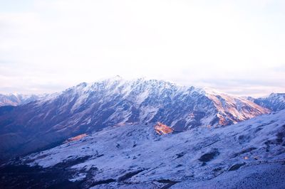 Scenic view of snow covered mountains