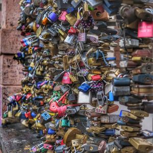 Close-up of padlocks hanging on metal