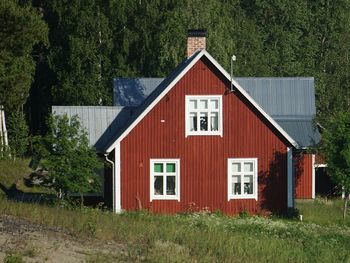 Red house on field