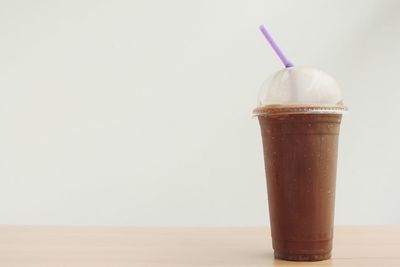 Close-up of coffee on table against white background