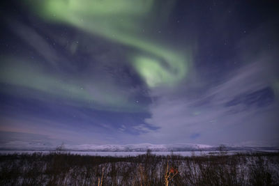 Scenic view of dramatic sky during winter at night