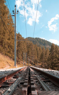 Surface level of railroad tracks against sky