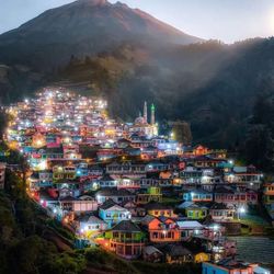 High angle view of illuminated buildings in city