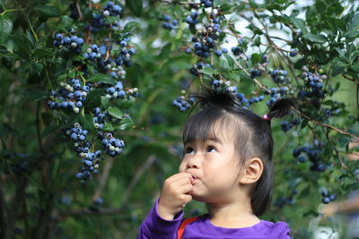 Portrait of cute girl with vegetables