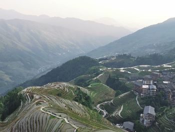 High angle view of vineyard against sky